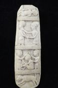 A 19th century west African ivory plaque, carved with medicine men and a dog, 8in.