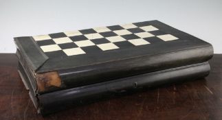 An Anglo Indian horn and ivory inlaid folding chess and backgammon board, modelled as two books,