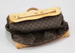 A Louis Vuitton travel bag, with tan leather top and base marked Louis Vuitton, Paris, no.AS0061,