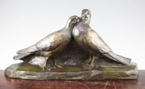 A French Art Deco patinated bronze model of two doves, on naturalistic base, signed D'Aste Salon