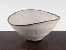 Dame Lucie Rie D.B.E. (1902-1995). A stoneware elliptical bowl, the dark brown stoneware body