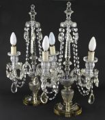 A pair of early 20th century cut glass lustre hung glass table lamps, each with twin branch with a