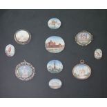 A collection of ten Indian oval painted miniatures, topographical scenes and birds, now mounted on