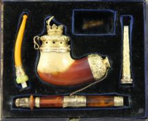 A Victorian cased Meerschaum pipe smoking set, with 18ct gold mounts marked for RD, London 1853,