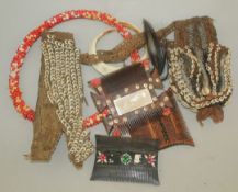 A collection of Papua New Guinea beadwork items, together with two combs, a boar's tusk pendant