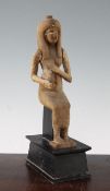 A carved wood figure of a seated ancient Egyptian woman, with inlaid eyes and later arms, on