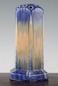 A Ruskin pottery hexagonal flower stand, dated 1930, covered in a blue drizzled and orange souffle
