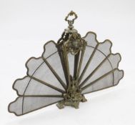 A late 19th / early 20th century French bronze folding fan shape fire screen, with acorn and