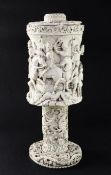 A large 19th century North European carved ivory vase and cover, probably German, the body relief