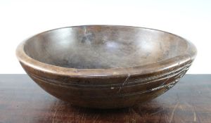 A 19th century turned fruitwood bowl, with simple ring turned decoration, 14.25in.