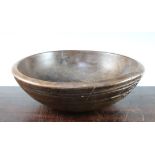 A 19th century turned fruitwood bowl, with simple ring turned decoration, 14.25in.