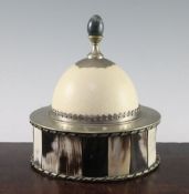 Anthony Redmile. A circular horn and ostrich egg box and cover, with green hardstone finial,