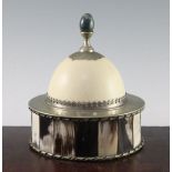 Anthony Redmile. A circular horn and ostrich egg box and cover, with green hardstone finial,
