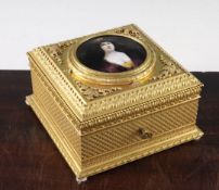 A late 19th century French ormolu casket, the lid inset with a circular Limoges enamelled portrait