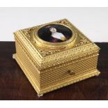 A late 19th century French ormolu casket, the lid inset with a circular Limoges enamelled portrait