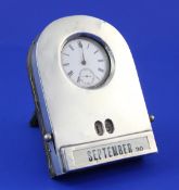 An early 20th century silver mounted combination desk watch holder and calendar, of domed form, with