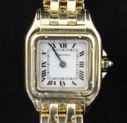 A lady's 18ct gold Cartier Panthere quartz wrist watch, with Roman dial and cabochon sapphire set