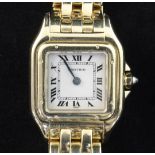 A lady's 18ct gold Cartier Panthere quartz wrist watch, with Roman dial and cabochon sapphire set