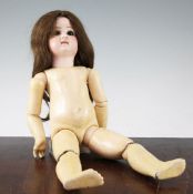 A Jumeau bisque head Bebe doll, with fixed brown eyes, bisque head marked Depose, with jointed