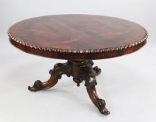 An early Victorian rosewood circular breakfast table, with gadrooned border, gadrooned vase shaped