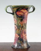 A William Moorcroft Spanish pattern tall two handled vase, c.1917, with a pale green / blue