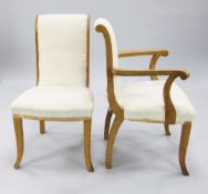 A set of six Art Deco maple dining chairs, with scroll backs, over-stuffed seats, on splayed front