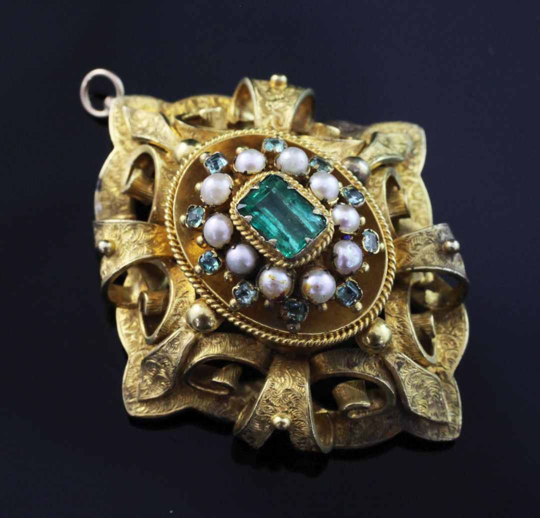 A Victorian gold, emerald and split pearl set oval brooch, with engraved pierced scroll mount and - Image 2 of 2