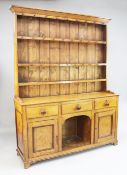 A 19th century oak dresser, the back with three fitted plate shelves above three frieze drawers