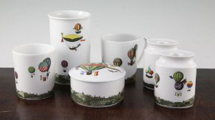 Fornasetti for Rosenthal porcelain. Two candle holders, a box and cover, two mugs and a beaker, in