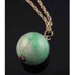 A gold mounted spherical jadeite bead pendant, on a 9ct gold chain, pendant diameter 21mm.