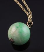 A gold mounted spherical jadeite bead pendant, on a 9ct gold chain, pendant diameter 21mm.