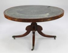 A Regency mahogany circular library table, with gilt tooled leather inset top, with turned central