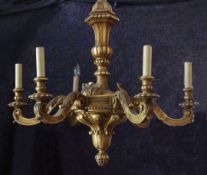 An Italian carved giltwood six branch chandelier, with central gadrooned ball knop carved