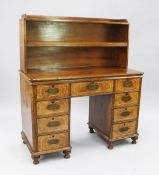 A 19th century Anglo Chinese campaign desk, with amboyna drawer fronts and ivory stringing, the