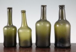 Four Dutch olive green glass bottles, late 18th century, with applied rims and high pontils, with