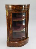 A Victorian figured walnut and marquetry inlaid corner display cabinet, with single bowed glazed