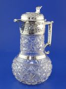A George V silver mounted cut glass claret jug by Goldsmiths & Silversmiths Co Ltd, with bulbous
