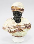 A large 20th century onyx and marble carved bust of an Arab, on circular base, unsigned, 2ft 4ins