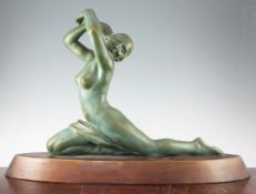 A French Art Deco painted terracotta model of a female nude dancer, on an oval base marked L.Alliot,