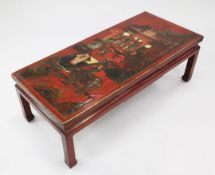 A Chinese rectangular lacquered coffee table, the top decorated with a figural scene with pagoda and