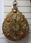 A late 19th century Continental embossed copper and brass 'Telleruhr' wall clock with Roman numerals