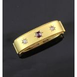 A late Victorian 15ct gold, ruby and diamond set scarf clip, in original box, gross 7.6 grams,
