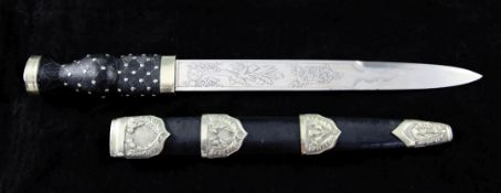 A 20th century Scottish dirk, with 11.75 inch etched blade with basket weave grip and silver