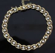 An 18ct gold and diamond curb link bracelet, set with twenty six round old cut stones, gross