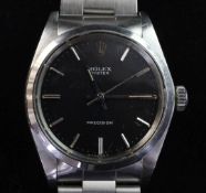 A gentleman's late 1960's stainless steel Rolex Precision manual wind wrist watch, with black dial