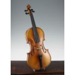 A late 19th / early 20th violin, with two piece back and interior label for Genre Maggini, length of