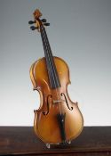 A late 19th / early 20th violin, with two piece back and interior label for Genre Maggini, length of