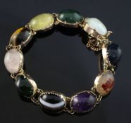 An Edwardian 9ct gold and multi cabochon gem set bracelet, with ten silver backed stones including