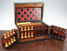 A Victorian burr walnut cased games compendium, with hinged lid and front doors opening to reveal