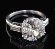 A mid 20th century platinum and single stone diamond ring, with baguette cut diamond set